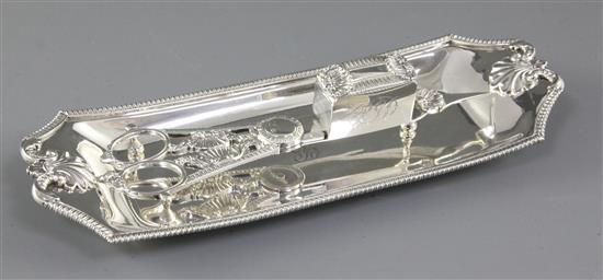 A pair of George III silver candle snuffers and similar tray, tray length 250mm, weight 12.4oz/386grms.